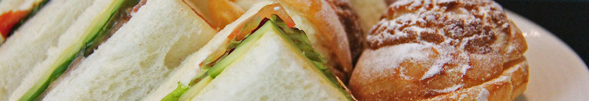 Eating Deli Sandwich at Pop's Deli & Grill restaurant in Hayward, CA.